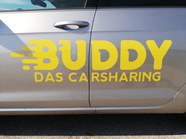 IMG_20190923_1206_vw e-golf_zweite begegnung wien_buddy carsharing birngruber_mortimer hydrochan schulz_logo das autotür